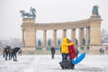 Tourists at Heroes' Square in snowfall #1432