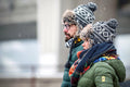 Couple with flat caps on March 15th Square in winter #2202