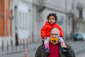 Granddaughter on grandfather's neck on the Danube bank #2401