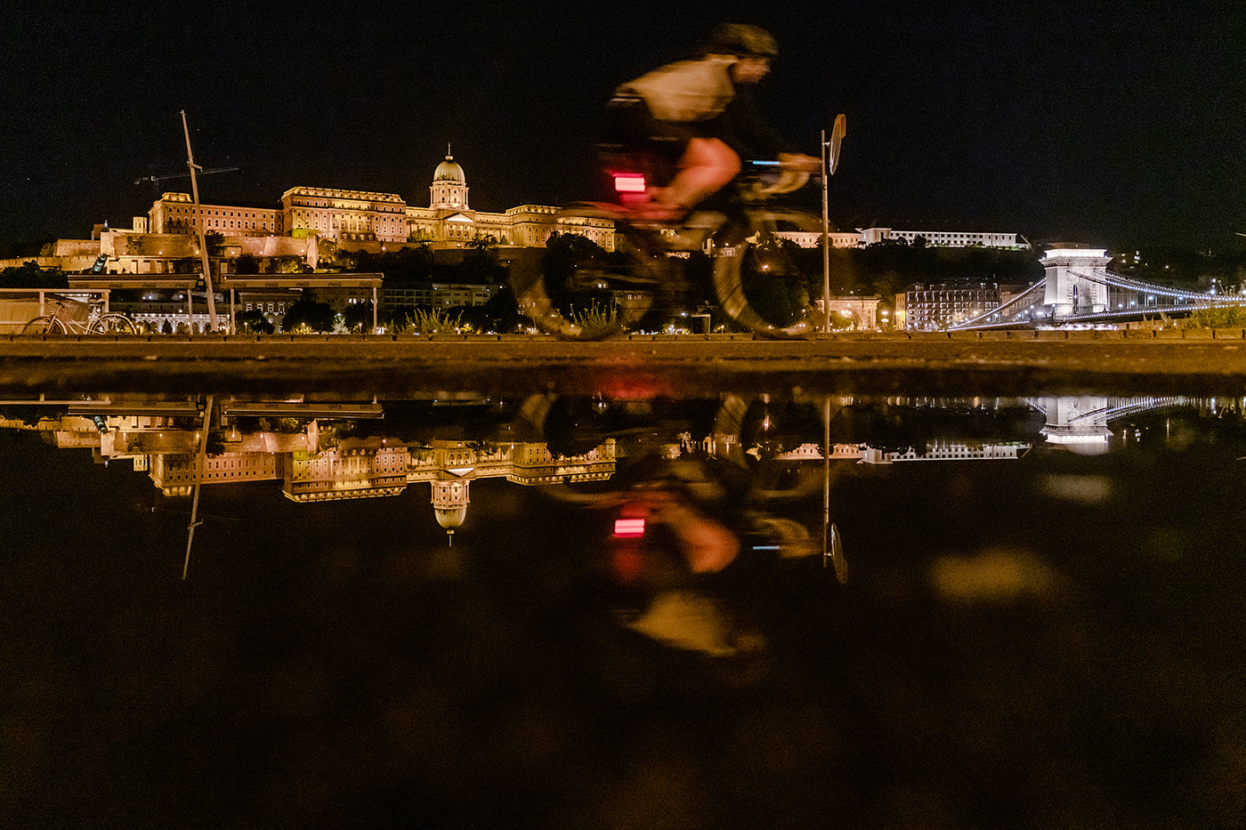 Cyclist on the closed lower quay in the evening after rain #2883