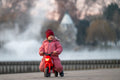 Little girl on a motorbike at the City Park lake #3150