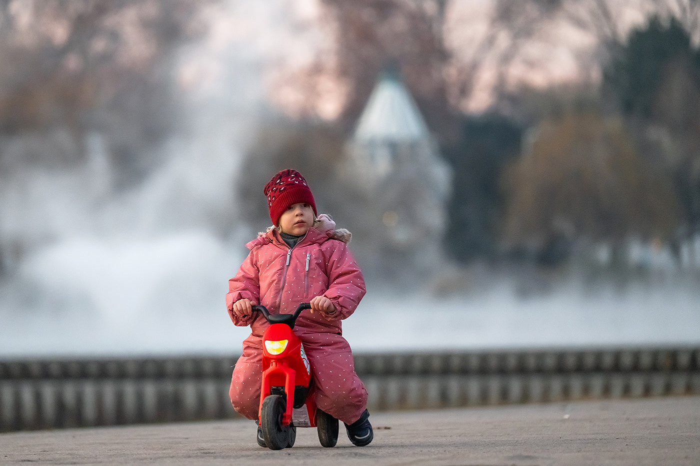 Little girl on a motorbike at the City Park lake #3150
