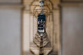 Elderly couple through the columns of Corvinus University #4280