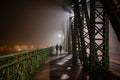 Walking on the Liberty Bridge on a foggy winter evening #6840